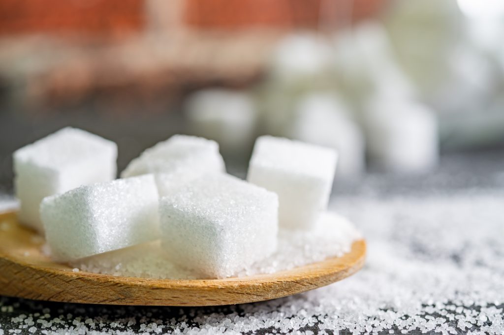 Sugar,Cubes,On,Black,Backround.,Sugar,Is,Unhealthy,Nutrition,And