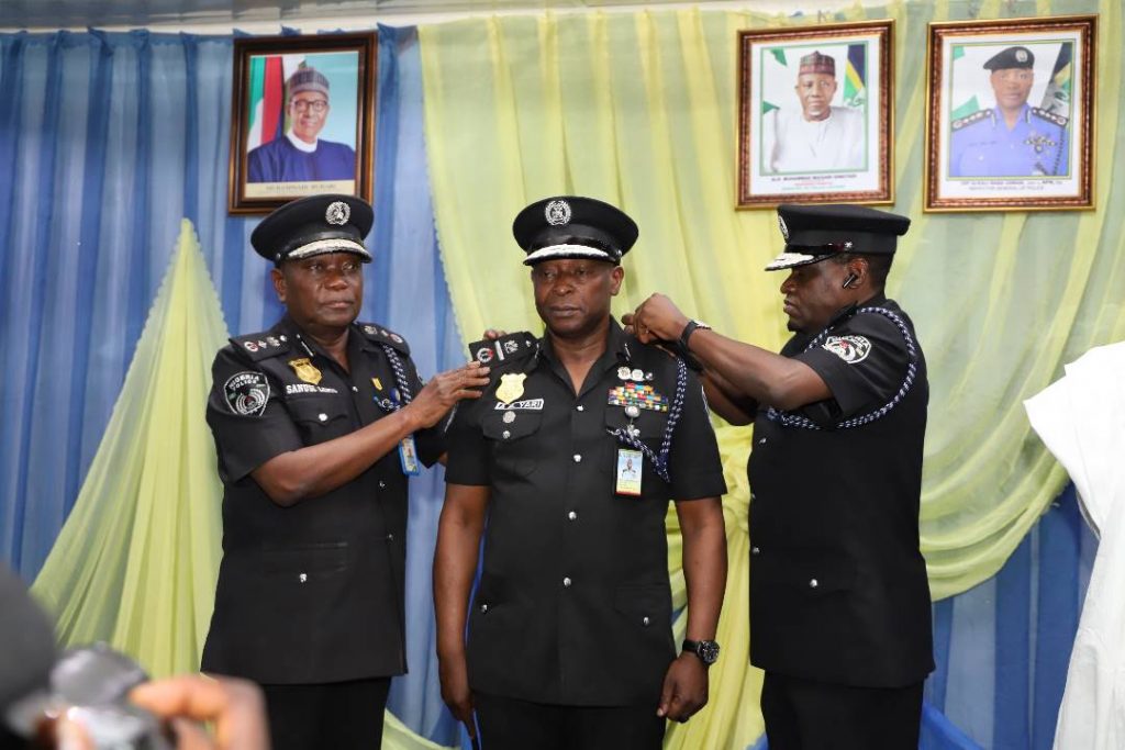FOUR HUNDRED AND SIXTY-FIVE POLICE OFFICERS GET PROMOTIONS 