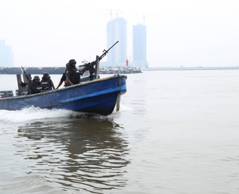 Armed police officers on an engine boat